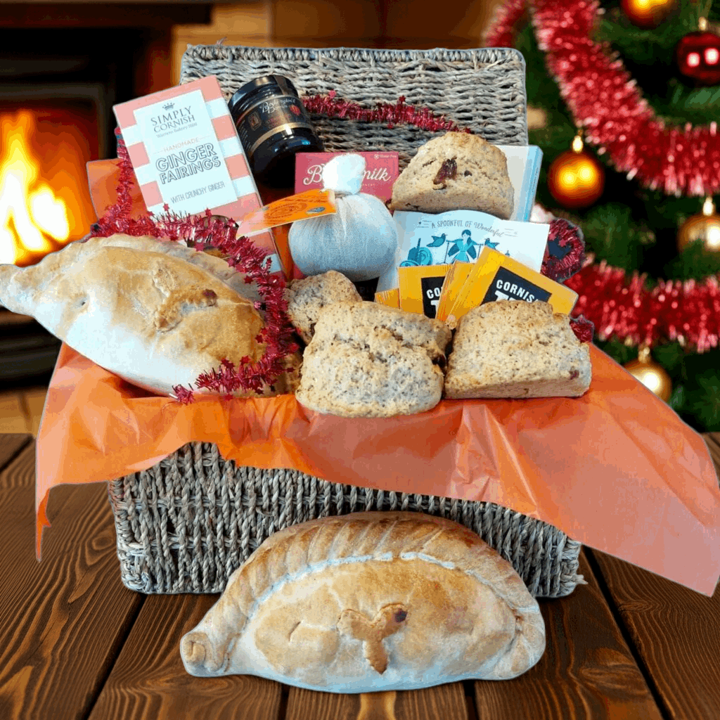 Christmas proper job gift hamper for two, with our delicious Christmas cream tea, Christmas pasty's cream tea chocolate bar, box of fairings, box of fudge and a Christmas pud.