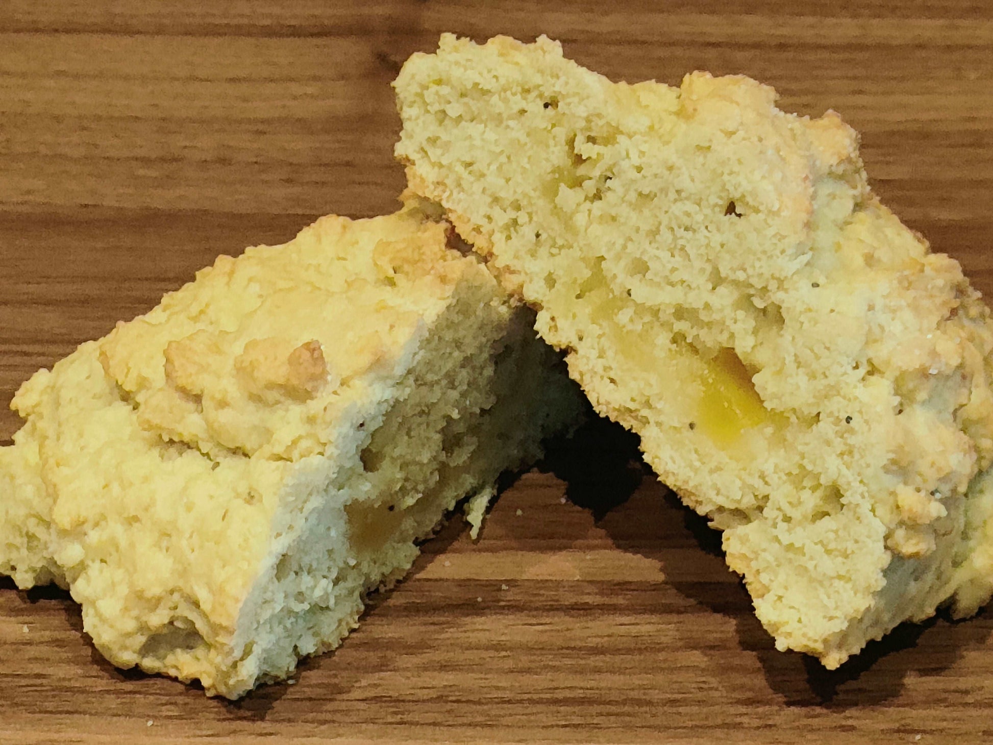 Lemon and poppy seed rock bun cut open to chow the lemon curd.