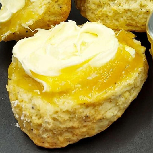 Lemon and Poppy Seed scone with lemon curd and Rodda's clotted cream, ready to eat - The Cornish Scone Company